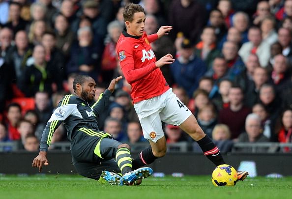 Manchester United's Belgium midfielder Adnan Januzaj (R) vies with Stoke City's Honduran midfielder Wilson Palacios (L) during the English Premier League football match between Manchester United and Stoke City at Old Trafford